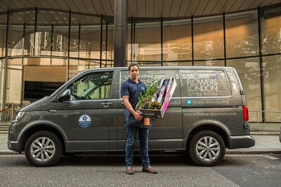 Mr Rocha's company normally supplies flowers and Christmas trees to offices in central London but he has had to find new revenue streams. Rob Greig for The National