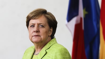 German chancellor Angela Merkel waits for the arrival of outgoing French president Francois Hollande prior to a meeting at the chancellery in Berlin. Markus Schreiber / AP Photo