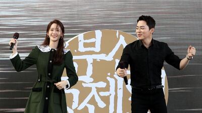 Actress Yoona and actor Cho Jung-seok dance during the Open Talk 'EXIT' at the Busan Cinema Center BIFF Theater during the 24th Busan International Film Festival. Getty Images