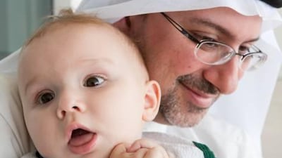 One-year-old Daniel Raed Alawadhi with his father Raed Alawadhi at the genetic disease conference in Dubai.