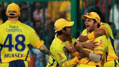 Suresh Raina is mobbed by his Chennai teammates after taking the wicket of the Mumbai captain Harbhajan Singh last night. Chennai next face Delhi in the second Qualifier to reach the IPL final tomorrow. Manjunath Kiran / AFP