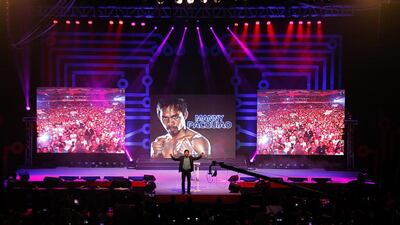 Manny Pacquiao gives an inspiration talk to a crowd of thousands in Manila last year, telling his story and discussing his religious faith. Mike Young for The National / May 8, 2014