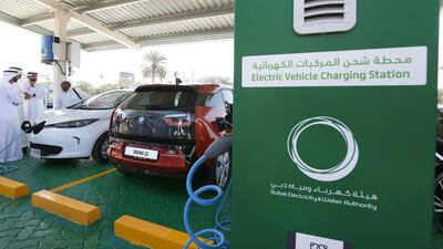 Electric cars on display during the launch of electric car charging station at DEWA headquarters in Garhoud in Dubai. Pawan Singh / The National