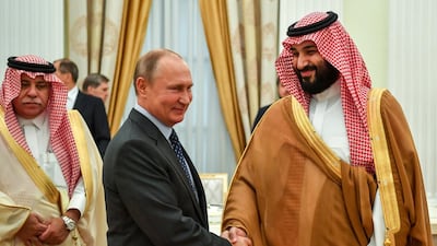 President Vladimir Putin, shakes hands with Saudi Arabian Crown Prince Mohammed bin Salman. AP