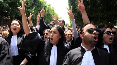 Tunisian lawyers take part in a protest against the recent arrests of their colleagues, in Tunis. AP