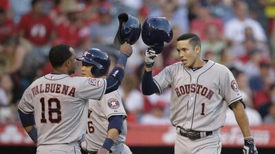 Houston Astros' Carlos Correa, right, is leading the way as rookies continue to storm MLB. Jae C Hong / AP Photo / June 23, 2015