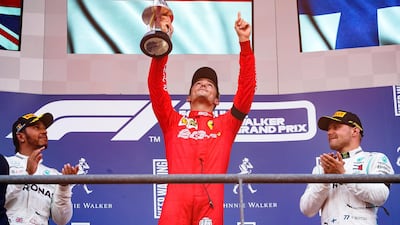 Charles Leclerc, centre, celebrates on the top step of the podium after winning the Belgian Grand Prix. EPA