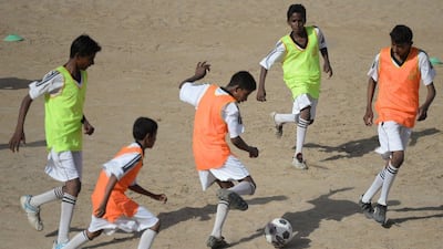 Youth in Karachi, Pakistan train at a local pitch as part of an academy funded by the Real Madrid Foundation. Asif Hassan / AFP