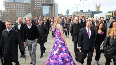 Paradise Garden joins the London City commute - a dress of a 1,000 Orchids created by M&G Investments leads the way to the RHS Chelsea Flower Show sponsored by M&G Investments that opens next week. The dress made of 1,000 Orchida Vanda petals reflects the theme of M&G's own garden at the show - a contemporary paradise garden. 2014 marks the fourth year M&G Investsments have been the title sponsor of the RHS Chelsea Flower Show. This year's M&G garden is designed by Cleve West. The model's dress took over 50 hours to create and is based on the harmony and energy that has underpinned paradise gardens across the world throughout history. The RHS Chelsea Flower Show sponsored by M&G Investments opens on Tuesday 20 May and runs until Saturday 24 May 2014. Stuart C. Wilson / Getty Images for M&G Investments