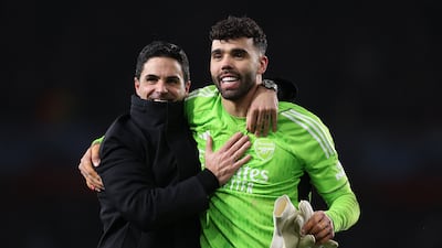LONDON, ENGLAND - MARCH 12: Mikel Arteta, Manager of Arsenal, and David Raya of Arsenal embrace at full-time after victory in the penalty shoot out following the UEFA Champions League 2023/24 round of 16 second leg match between Arsenal FC and FC Porto at Emirates Stadium on March 12, 2024 in London, England. (Photo by Julian Finney / Getty Images)