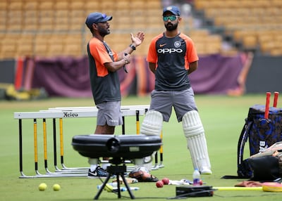 Ajinkya Rahane, right, proved to be a ruthless captain while standing in for Virat Kohli. Aijaz Rahi / AP Photo
