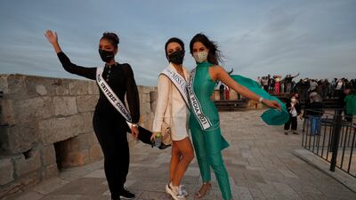 Colombia's Valeria Ayos, left, Armenia's Nane Avetisyan, centre, and India's Harnaaz Sandhu pose as members of the Miss Universe beauty pageant. EPA