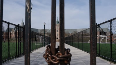 A fence secured with a lock and chain is seen at the entrance to the New Rochelle High School in New Rochelle, New York, USA. Bloomberg
