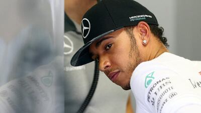 Mercedes-GP driver Lewis Hamilton prepares in the garage before the Brazilian Grand Prix at Autodromo Jose Carlos Pace on November 9, 2014, in Sao Paulo, Brazil. Clive Mason / Getty Images