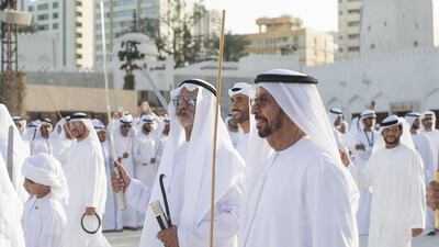 Hamad bin Suhail Al Khaili, and Sheikh Nahyan dance inside the grounds of Qasr Al Hosn fort. Ryan Carter / Crown Prince Court - Abu Dhabi