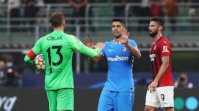 Luis Suarez interacts with Jan Oblak of Atletico Madrid. Getty Images