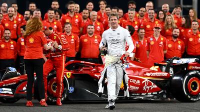 Brad Pitt, star of the coming Formula One-based film, F1, walks from the Ferrari team photo before the Abu Dhabi Grand Prix at Yas Marina Circuit. Getty Images