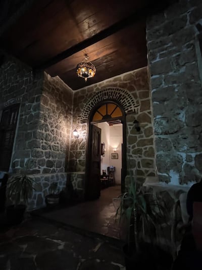 The arched stone entrance of El Quseir Hotel at night. Photo: El Quseir Hotel