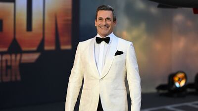 Jon Hamm wore a white tuxedo. AFP
