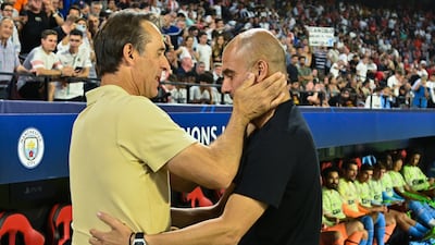 Sevilla coach Julen Lopetegui greets Manchester City Pep Guardiola ahead of the the match. EPA