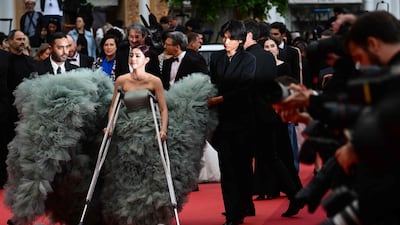 Not even crutches can stop Shin Yubin making an entrance. AFP