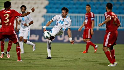 Baniyas's Yousef Jaber struggles to find a way past the Jazira defence at Baniyas Stadium. Jeff Topping/The National