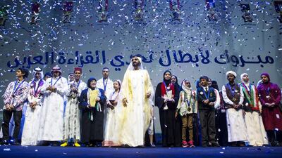 Sheikh Mohammed bin Rashid, Vice President and Ruler of Dubai, stands with the finalists of the Arab Reading Challenge during the closing award ceremony at the Dubai Opera. Christopher Pike / The National