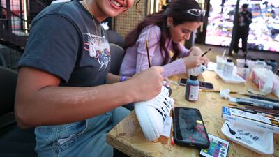 Elnaz Tabaei custom paints trainers at Bred Abu Dhabi