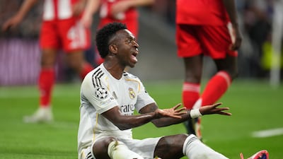Real attacker Vinicius Junior shows his frustration after being denied first-half penalty by English referee Michael Oliver. Getty Images