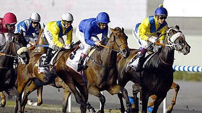 With Lanfranco Dettori aboard, Khawlah settles back in position to make a grab for the UAE Oaks at the Meydan racecourse.