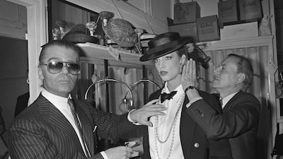 Lagerfeld continued on with Gabrielle Chanel's mix of mannish suiting and feminine jewellery, as seen here in 1983. AFP