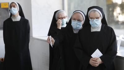 A group of nuns wait to cast their votes at a polling station in Santiago de Compostela, Galicia, Spain. Galicia holds regional elections, which were originally scheduled in April and postponed because of the coronavirus pandemic. EPA