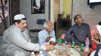 Bedouins are seated for Iftar during Ramadan. Yusri Mohammad