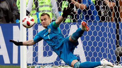 Igor Akinfeev of Russia saves the last penalty during the shootout between Spain and Russia. Sergei Chirikov / EPA