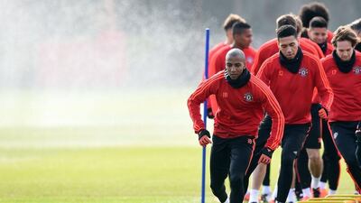 Manchester United’s English midfielder Ashley Young (L) and Manchester United’s English defender Chris Smalling (2nd L) take part in a team training session at their Carrington Training Centre in Manchester, north west England on March 16, 2016 ahead of their Uefa Europa League second leg football match against Liverpool. AFP / Paul ELLIS