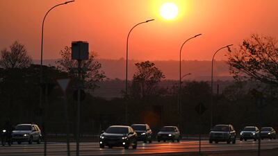 The Sun sets in Brasilia through a smoke haze from forest fires that have raged in the northern and central western states of Brazil for several weeks. AFP