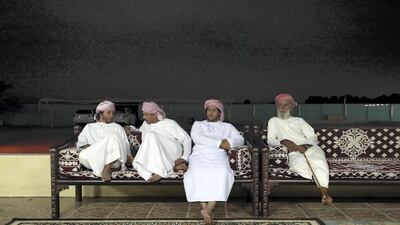 Camel traders and trainers hang out at one of the ezbas at Al Marmoom Heritage Festival in Dubai. Chris Whiteoak / The National