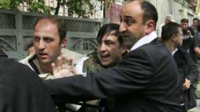 Mikheil Saakashvili is escorted by his bodyguards to a shelter in Gori, Georgia, yesterday.