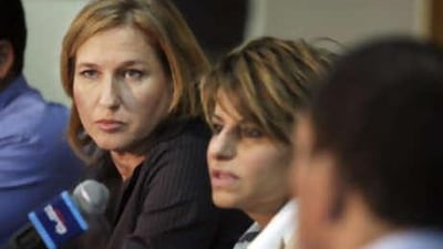 The Israeli foreign minister and prime minister-designate Tzipi Livni, left, attends a Kadima party gathering near Tel Aviv on Oct 23 2008.