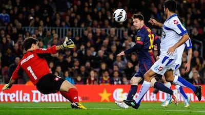 Barcelona's Lionel Messi scores his side's second goal against Deportivo La Coruna.
