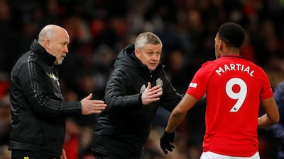 Manchester United manager Ole Gunnar Solskjaer and assistant manager Mike Phelan give instructions to Anthony Martial during the Premier League match against Aston Villa. Reuters