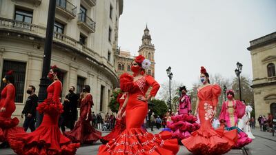Women wearing flamenco dresses protest in Seville, Spain, to highlight the difficulties the flamenco fashion sector is facing over coronavirus restrictions. AFP