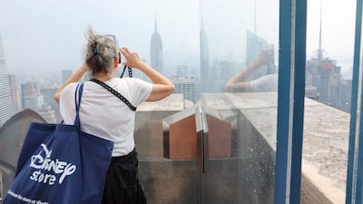 A dense haze hangs over Manhattan, with air quality levels falling as a result of more than 100 wildfires in Canada. AFP