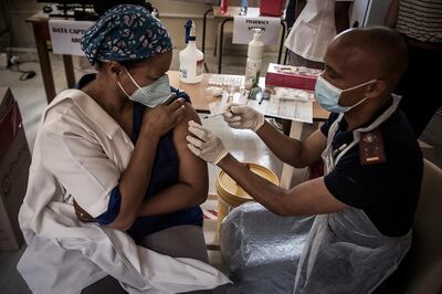 A healthcare worker receives a Covid-19 vaccine in Klerksdorp, South Africa. The G7 nations have pledged to increase inoculation support for poorer nations. AP