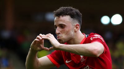 Diogo Jota of Liverpool celebrates after scoring their side's first goal during the Premier League match at Norwich City.