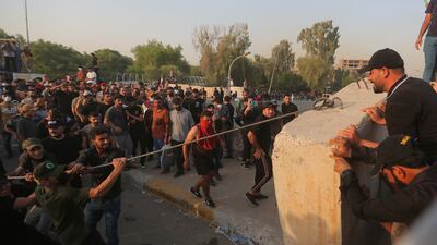 Supporters of a political alliance of Iran-backed groups attempt to storm government areas in the heavily fortified Green Zone in Baghdad, Iraq. AP