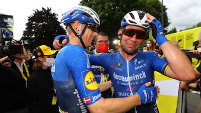 Mark Cavendish, right, celebrates with Deceuninck Quick-Step rider Michael Morkovafter winning Stage 4 of the Tour de France on Tuesday, June 29. EPA