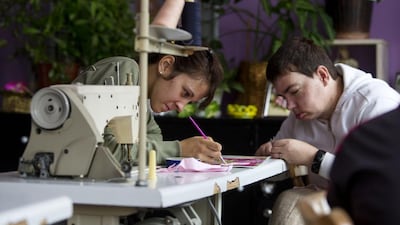 Residents of the Home for Children and Youth take part in a tailoring workshop in Sremicа.