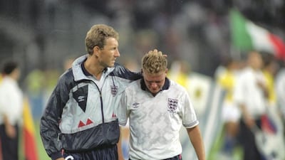 Terry Butcher (left) of England consoles teammate Paul Gascoigne after the 1990 World Cup semi-final against West Germany. Gascoigne would later go on to star in a commercial to promote Walkers crisps. Allsport UK