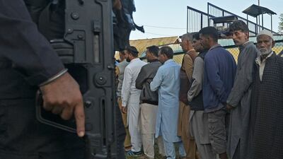 Voters queue outside a polling station in the final phase of voting in local assembly elections, in Bandipora district, northern Jammu and Kashmir. AFP